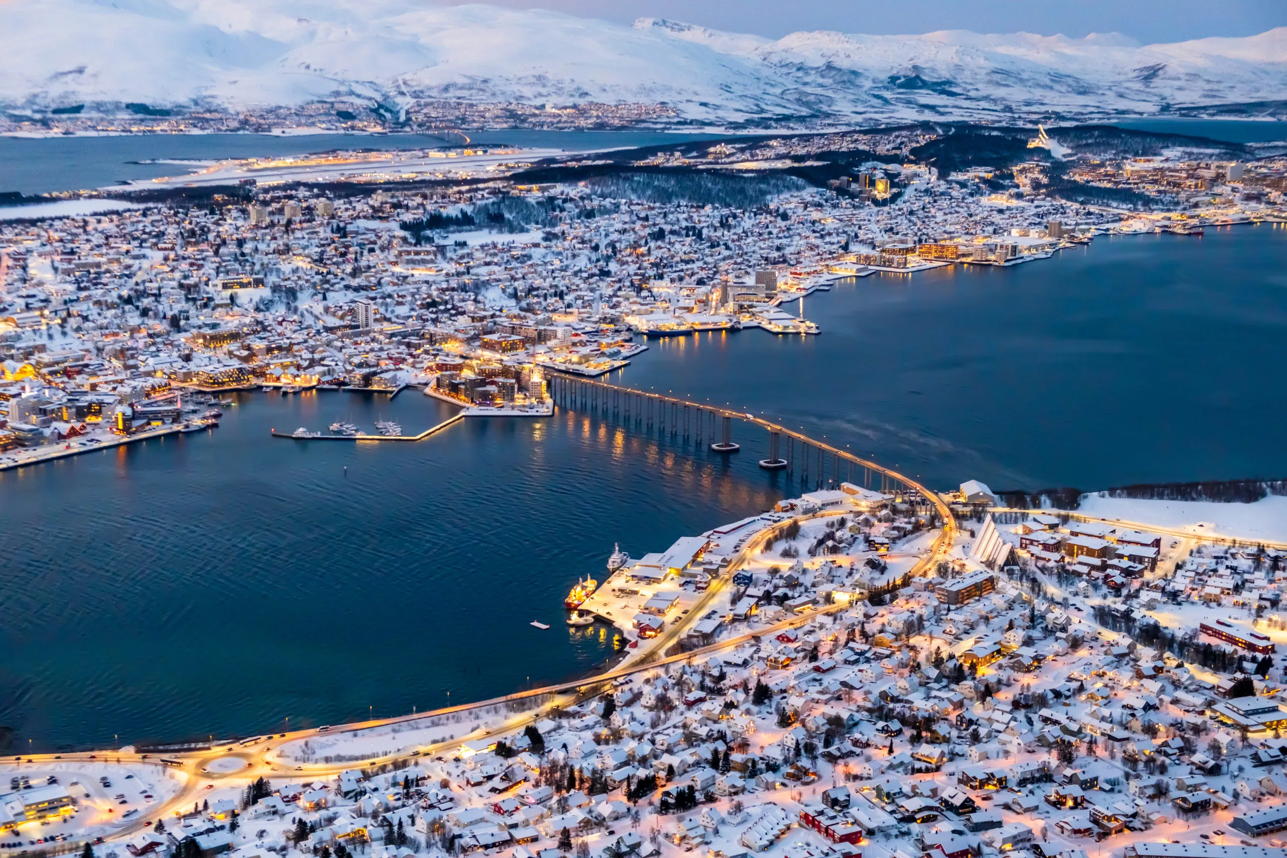 aerial-view-of-tromso-norway-with-city-lights-in-2024-12-05-21-29-09-utc-scaled