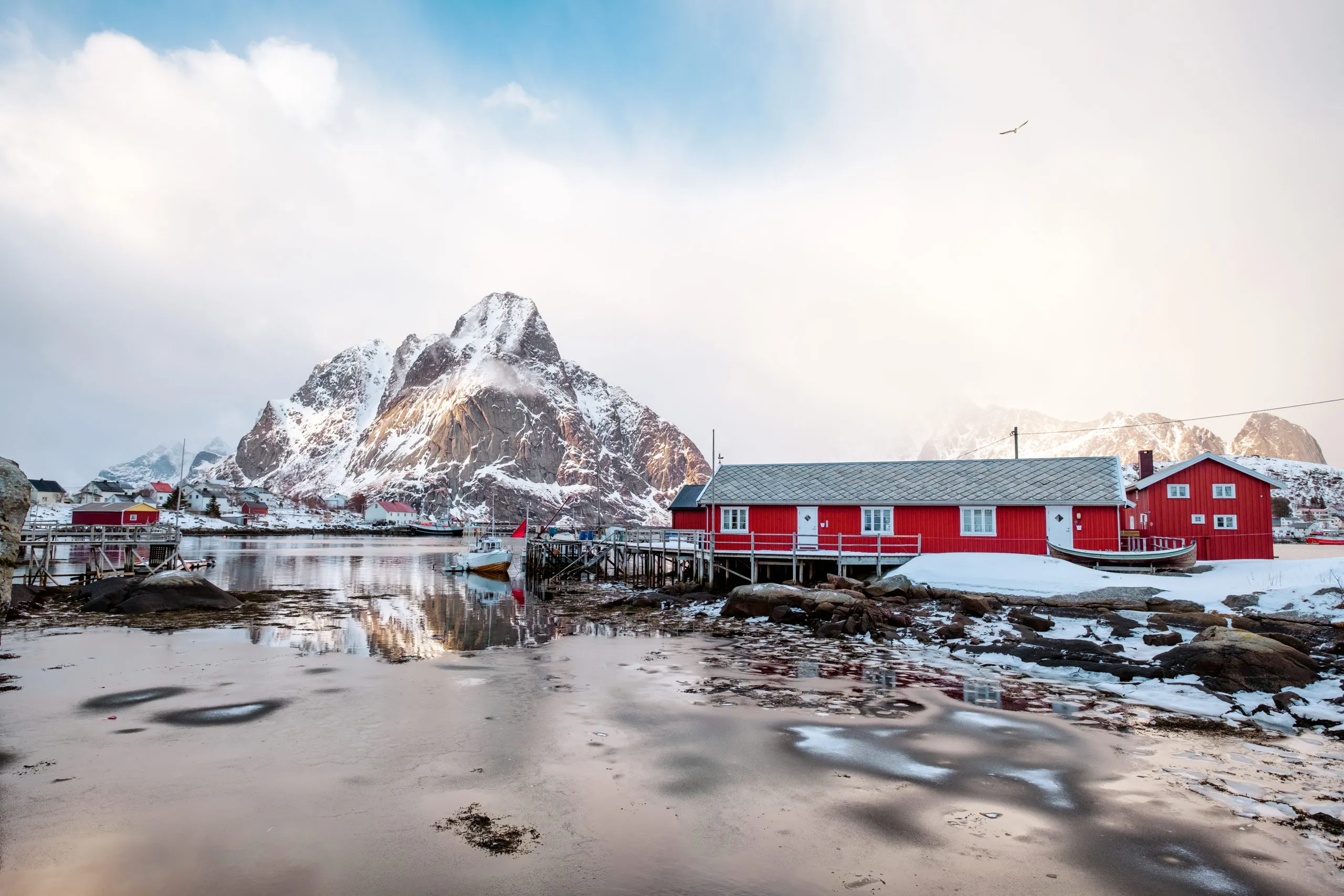 red-fishing-cottage-or-reine-rorbuer-with-snow-cov-2025-03-25-10-47-42-utc-scaled